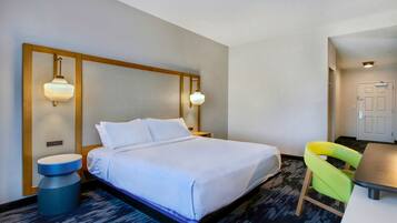 Premium bedding, desk, laptop workspace, blackout drapes