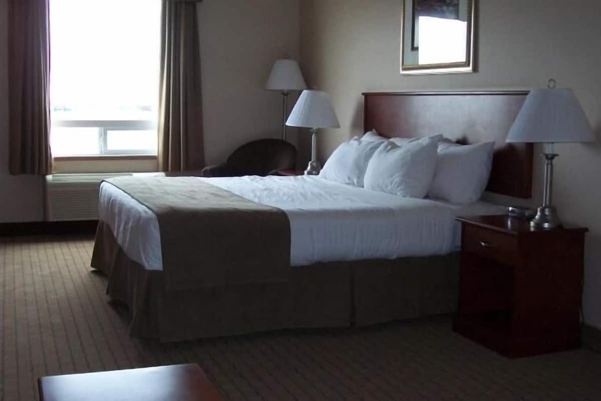 Desk, laptop workspace, blackout drapes, iron/ironing board