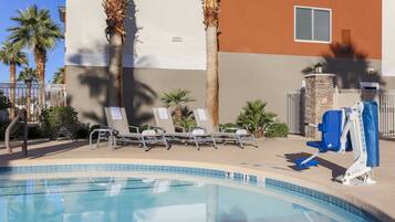 Outdoor pool, open 9:00 AM to midnight, pool loungers