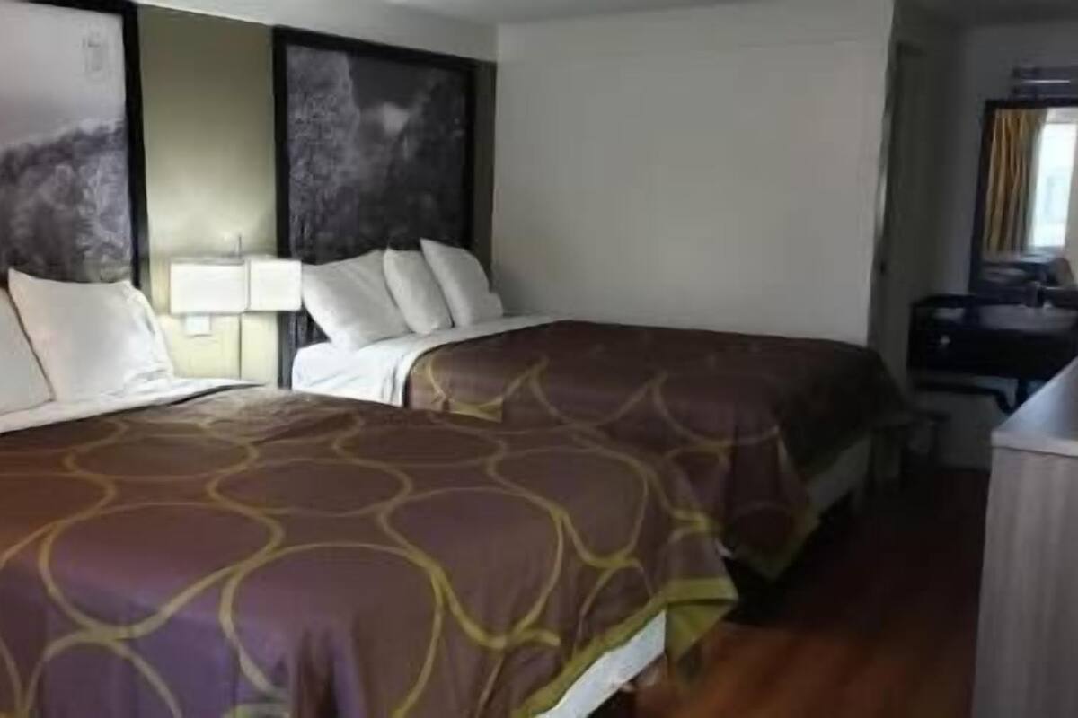 Premium bedding, pillow-top beds, blackout curtains, iron/ironing board