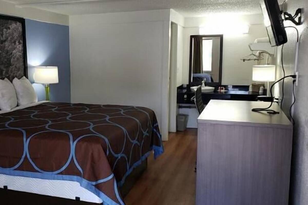 Premium bedding, pillow-top beds, blackout curtains, iron/ironing board