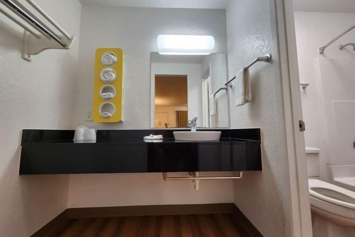 Combined shower/tub, hair dryer, towels, soap