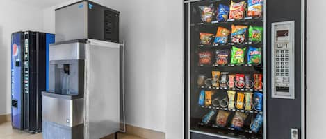 A vending machine with snacks and a water cooler.