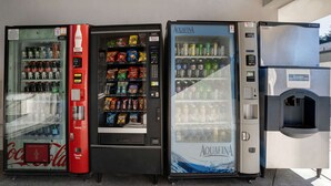 Three beverage vending machines with various drink options. - Motel 6 Arcata, CA - Cal Poly Humboldt (Arcata)