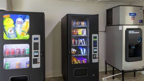 Two vending machines with various beverages and snacks, and a separate ice dispenser. - Motel 6 Lufkin, TX (Lufkin)