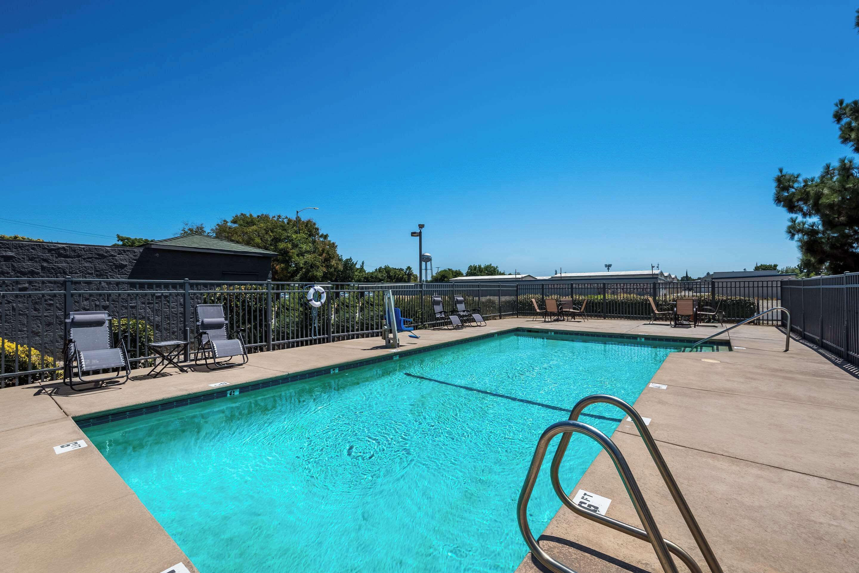 Seasonal outdoor pool, open 10:00 AM to 9:00 PM, sun loungers