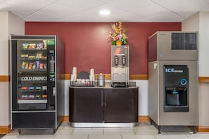 A vending machine labeled 'COLD DRINKS' and an ice dispenser in a commercial setting. - Red Roof Inn Greencastle South – Cloverdale (Cloverdale)