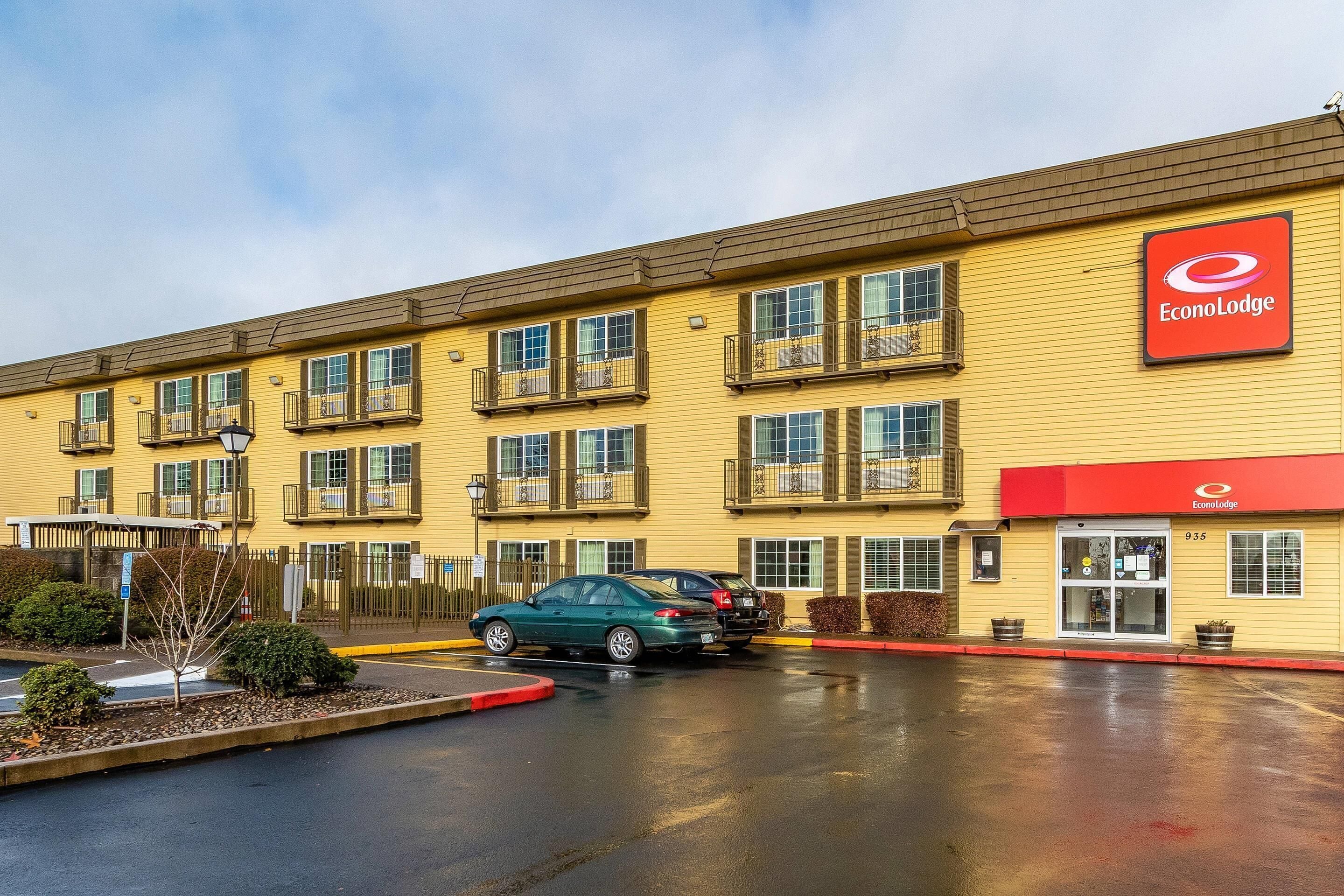 A yellow building with a red awning labeled "EconoLodge."