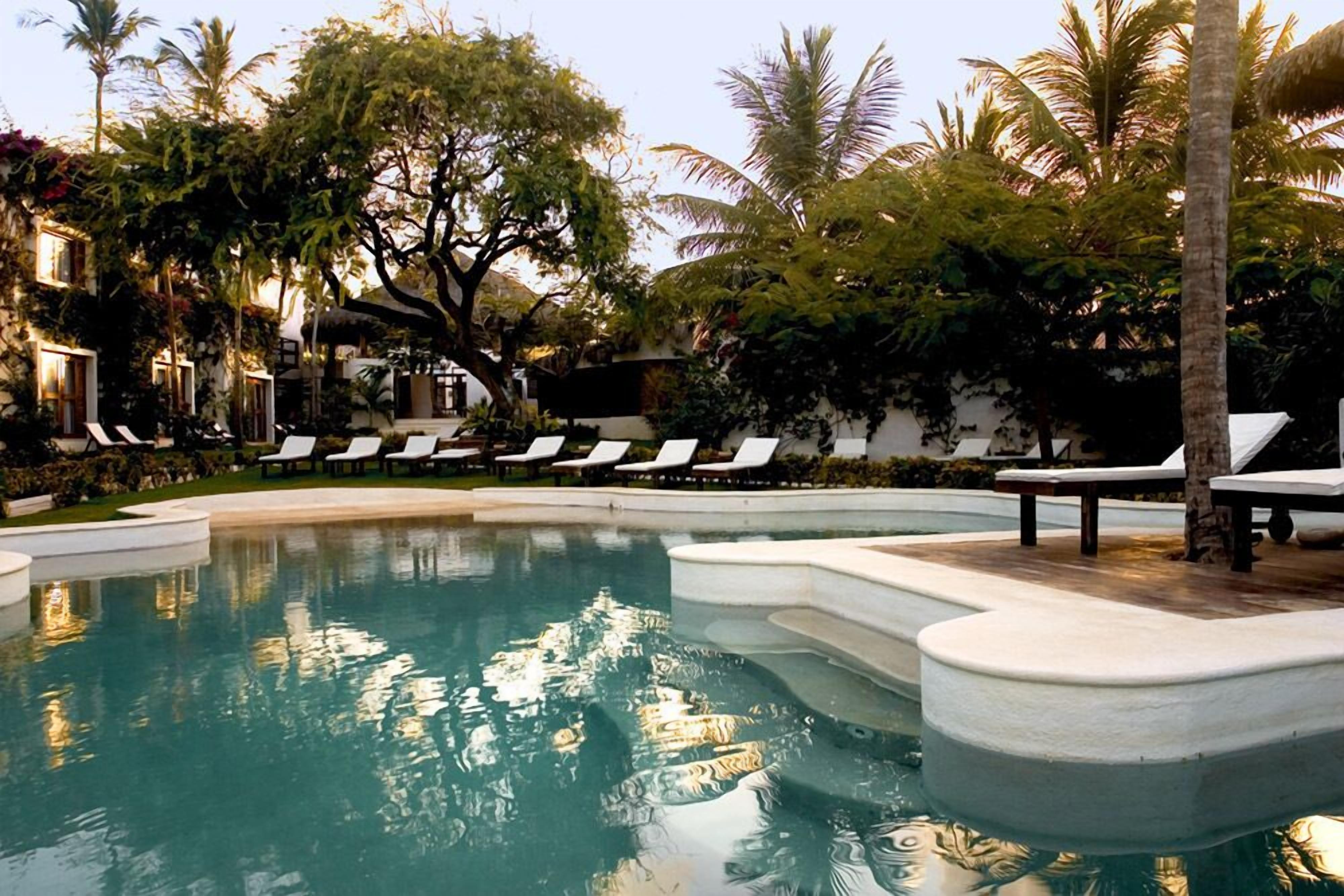 2 outdoor pools, open 9:00 am to 9:00 pm, pool loungers