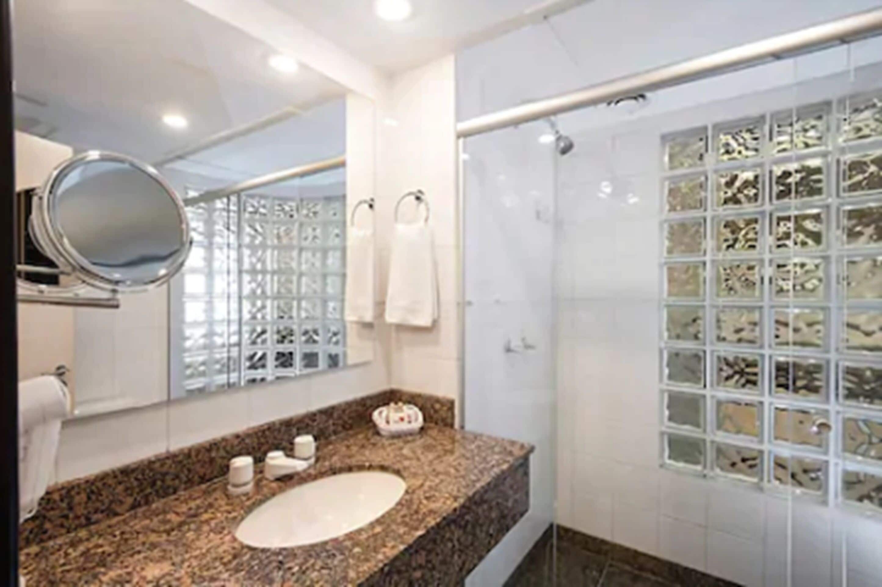 suite | bathroom | shower, hair dryer, towels, soap
