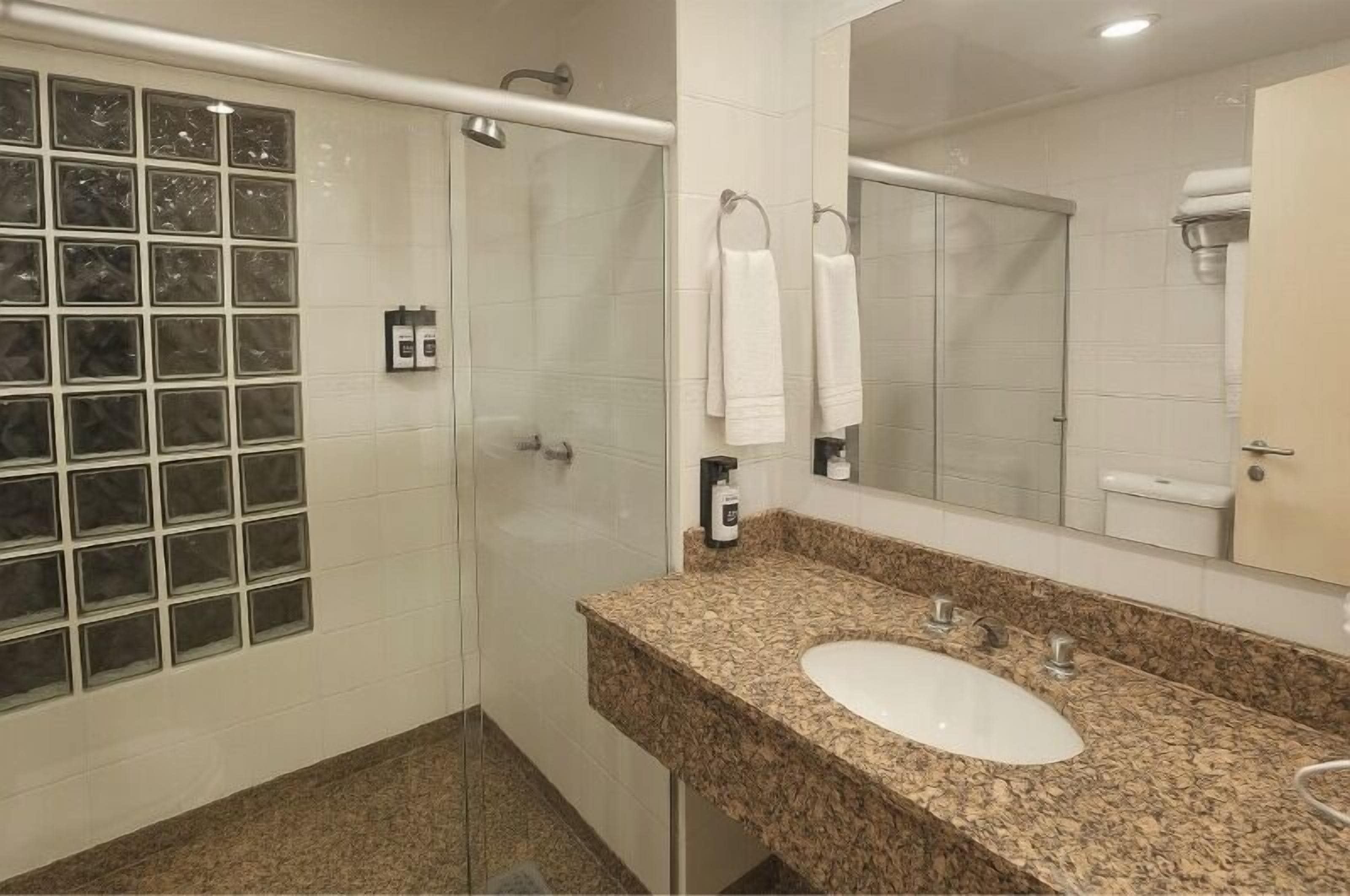 studio suite | bathroom | shower, hair dryer, towels, soap