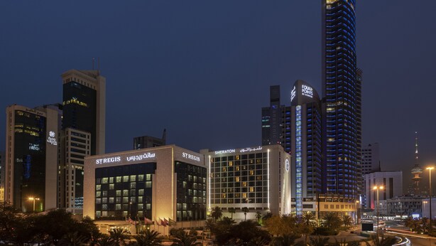 A modern hotel with a prominent sign reading "St. Regis" and "Sheraton" in Arabic. - Sheraton Kuwait, A Luxury Collection Hotel, Kuwait City (Kuwait City)