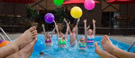 Seasonal outdoor pool, a heated pool, pool umbrellas, pool loungers