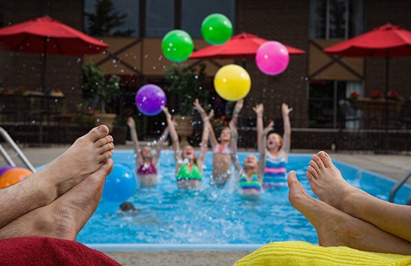 Seasonal outdoor pool, a heated pool, pool umbrellas, pool loungers