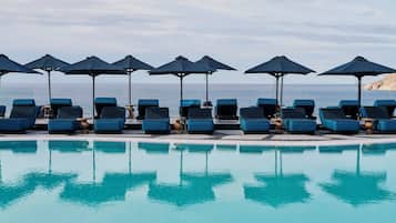 Seasonal outdoor pool, open 11:00 AM to 7:00 PM, pool umbrellas