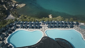 Seasonal outdoor pool, open 11:00 AM to 7:00 PM, pool umbrellas -  Myconian Imperial - Leading Hotels of the World (Mykonos)