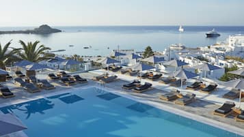 Relax by the pool surrounded by sea views and sun loungers.