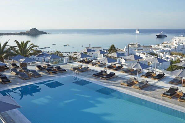 Outdoor pool, pool umbrellas, sun loungers