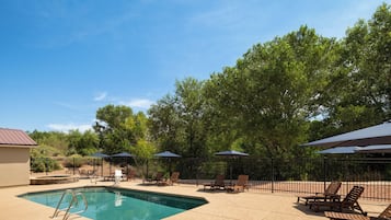 Outdoor pool, open 9:00 AM to 10:00 PM, pool umbrellas, pool loungers