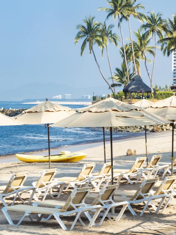 On the beach, sun loungers, beach umbrellas, beach towels