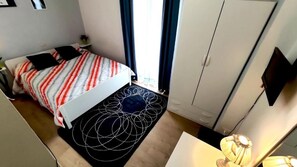 Habitación individual estándar | Minibar, escritorio, espacio para trabajar con laptop y wifi gratis 