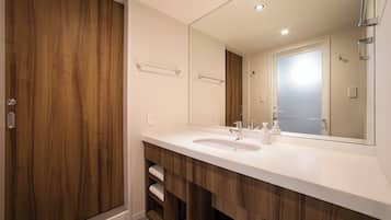 Eco-friendly toiletries, hair dryer, slippers, bidet