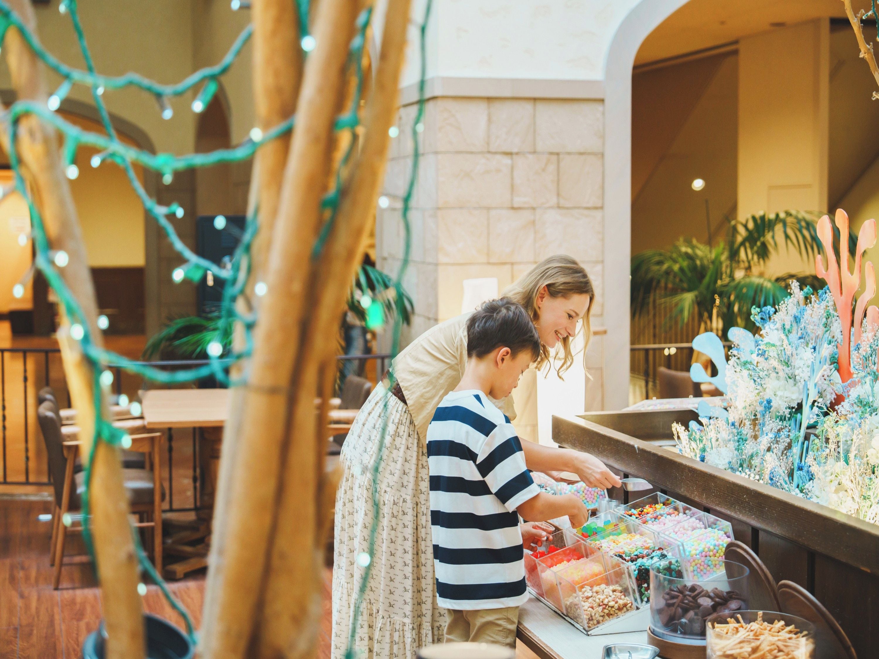 A dining area with a buffet table filled with various food items.