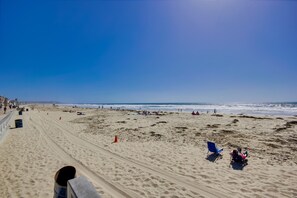 On the beach, surfing