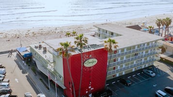 On the beach, surfing