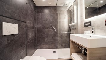 Shower, eco-friendly toiletries, hair dryer, towels