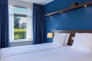 Quadruple Room | Hypo-allergenic bedding, in-room safe, desk, blackout drapes