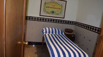 Cozy retreat with a single bed, wooden door, and decorative border.