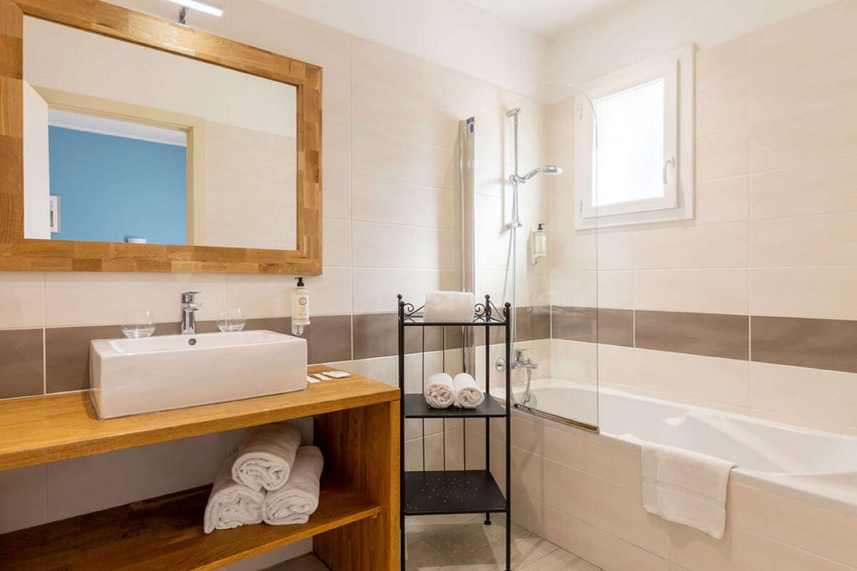 family room, multiple beds, balcony, garden view | in-room safe, iron/ironing board, free wifi, bed sheets