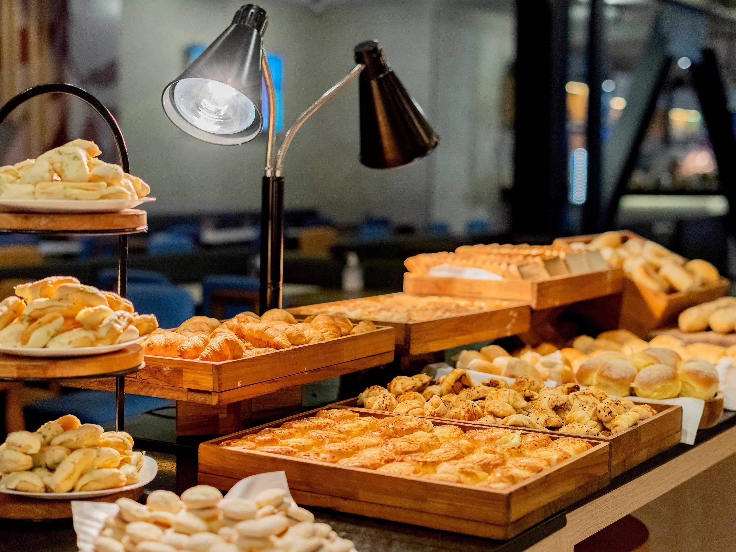 A bakery display with various baked goods.