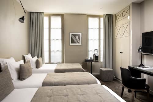 Habitació triple | Roba de llit d'alta qualitat i caixa forta a l'habitació