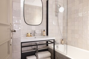 Deluxe Room | Bathroom | Designer toiletries, hair dryer, towels, soap