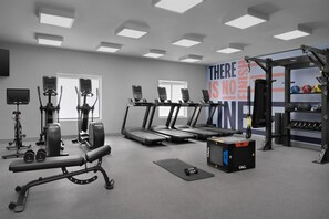 A gym with treadmills, weight machines, and a wall with motivational text. - Hampton Inn & Suites Roswell (Roswell)