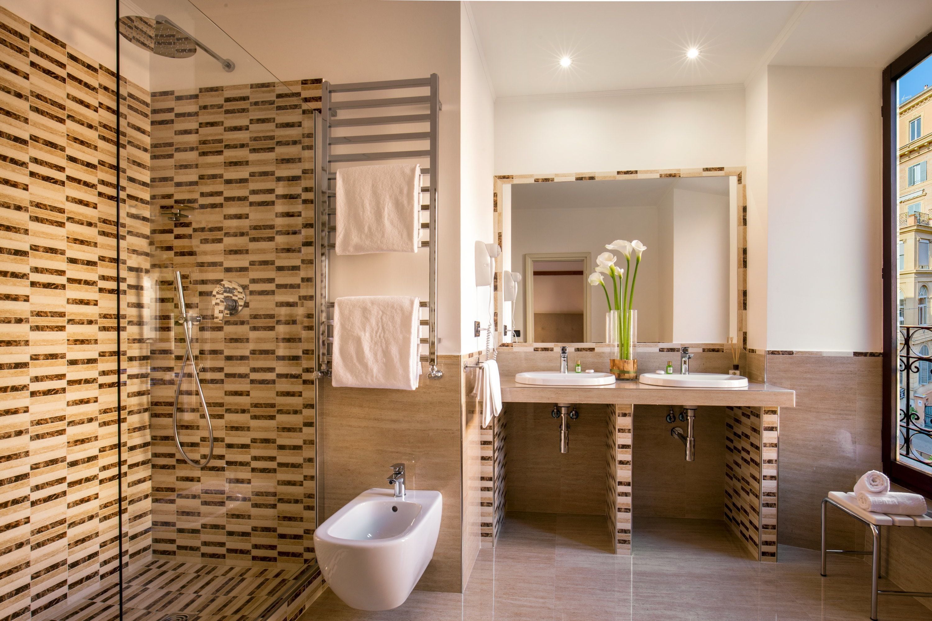 shower, hair dryer, bidet, towels