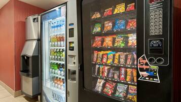 A vending machine with snacks and a water dispenser.