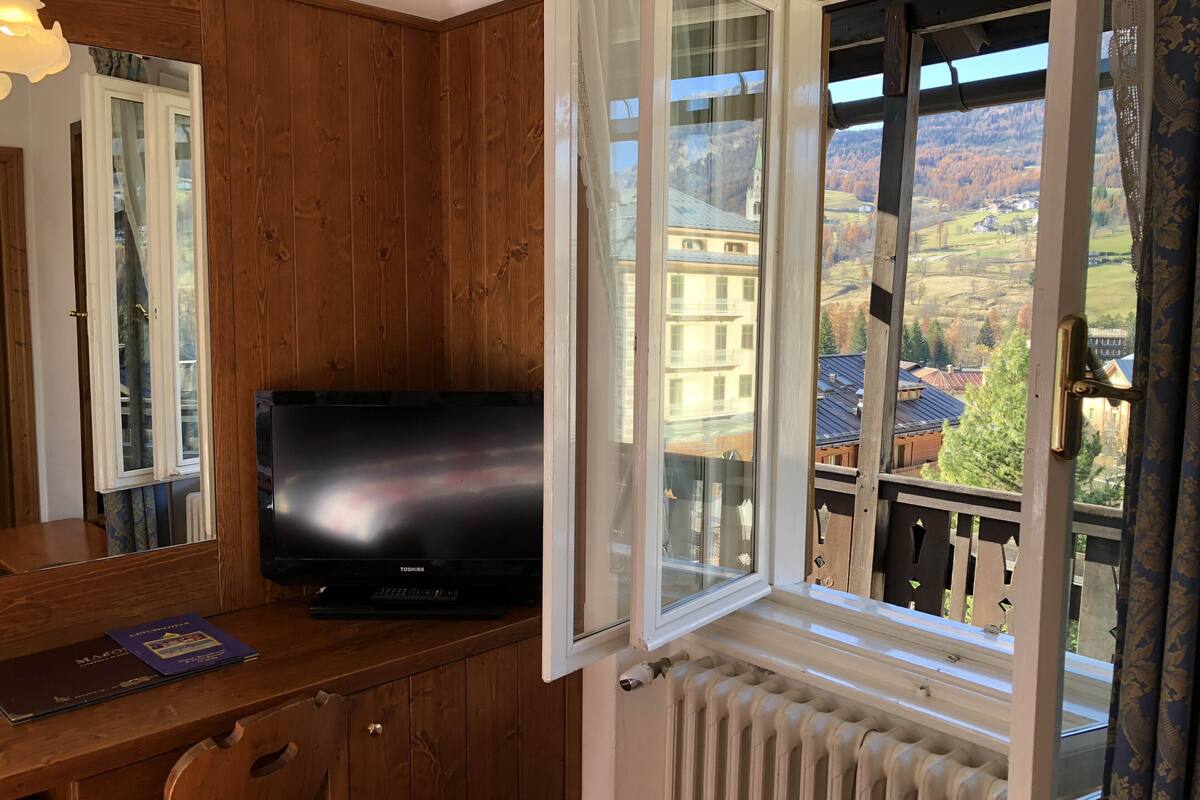 panoramic double or twin room, balcony, mountain view | 1 bedroom, minibar, in-room safe, cots/infant beds