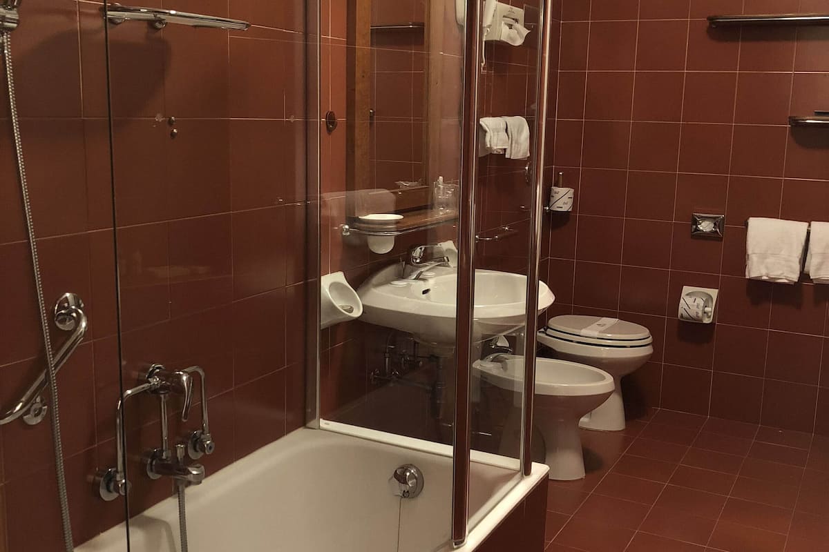 deep-soaking bathtub, free toiletries, hair dryer, slippers