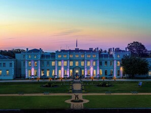 A large, historic building with a symmetrical facade, multiple windows, and a central entrance. - De Vere Wokefield Estate (Reading)