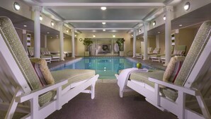 A pool area with lounge chairs and a pool. - Omni Bretton Arms Inn at Mount Washington (Bretton Woods)