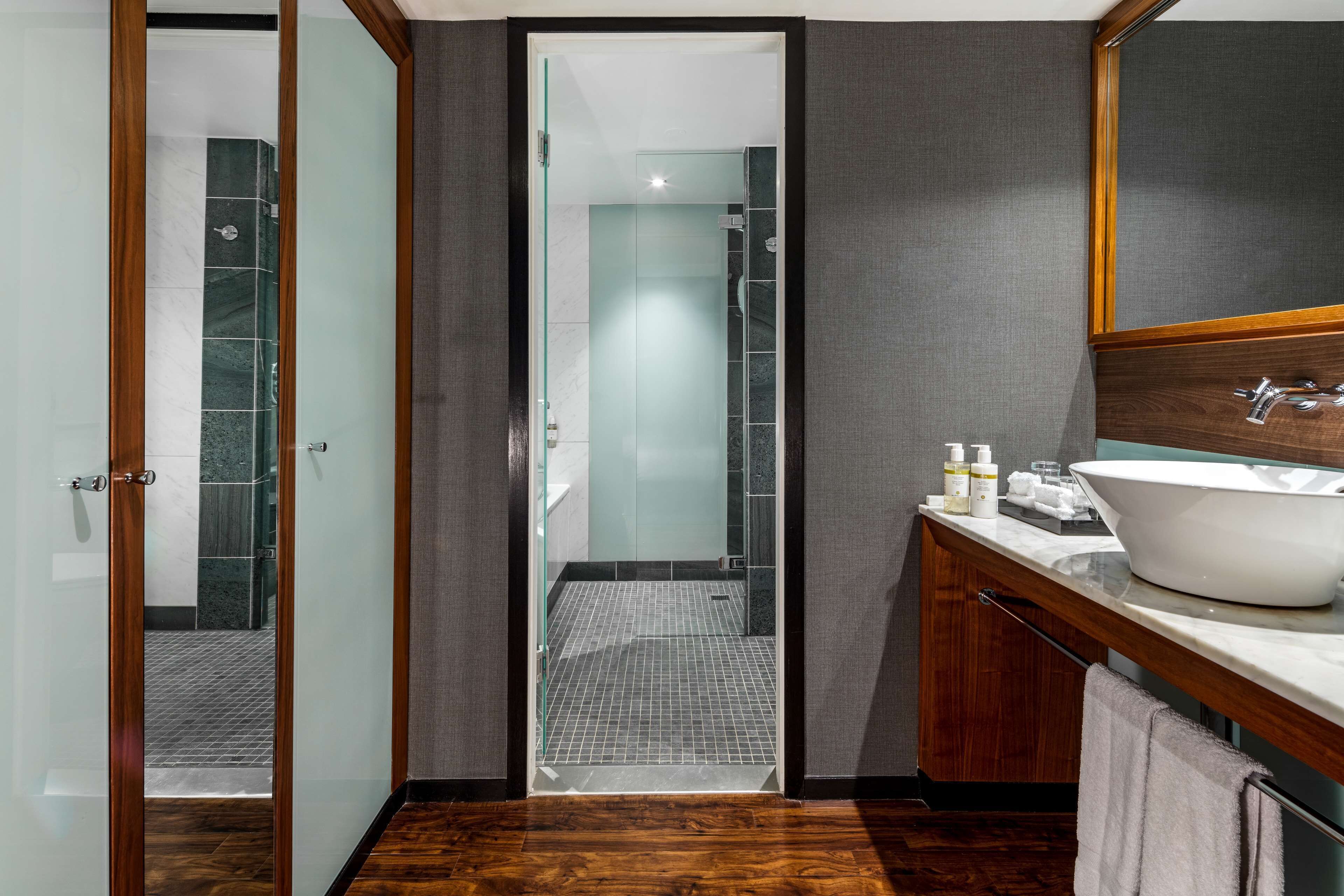 separate bathtub and shower, designer toiletries, hair dryer, bathrobes