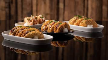 Three plates of food with a wooden background.