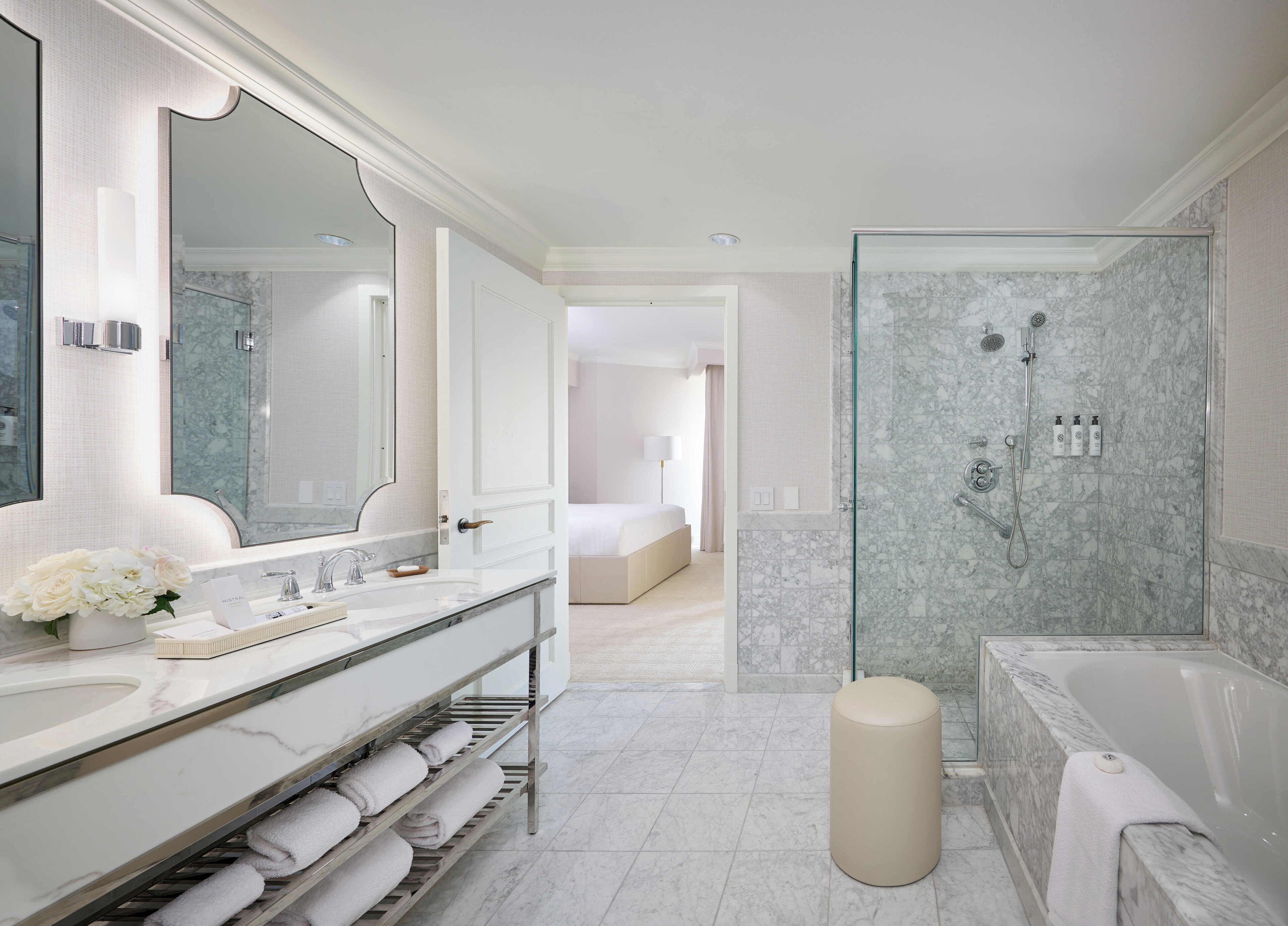 separate bathtub and shower, rainfall showerhead, designer toiletries