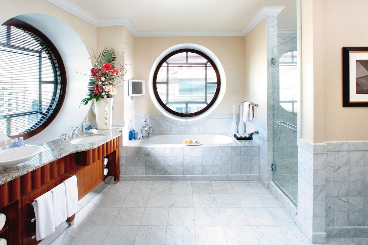 separate bathtub and shower, rainfall showerhead, designer toiletries