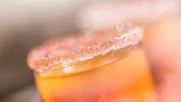 A close-up of a beverage with a salted rim.