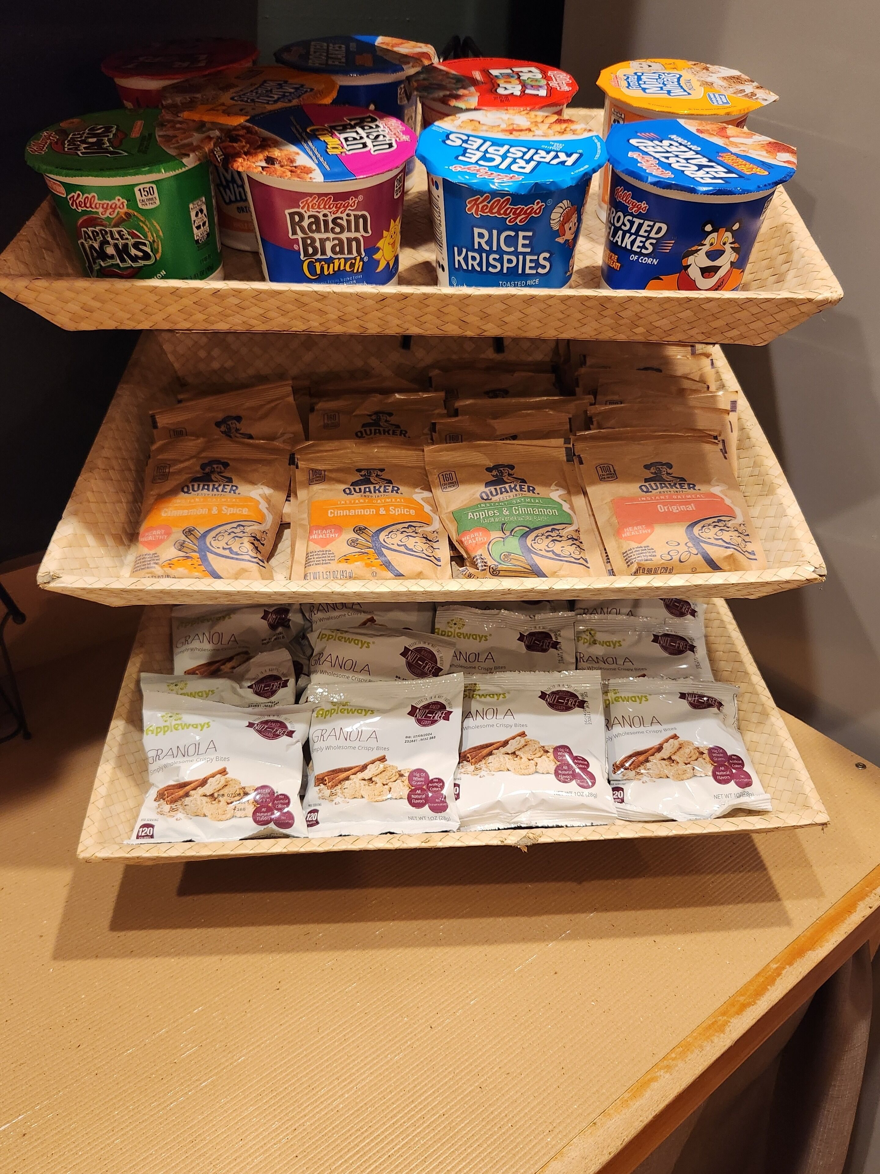 A display of various snack products including yogurt, rice krispies, and granola.