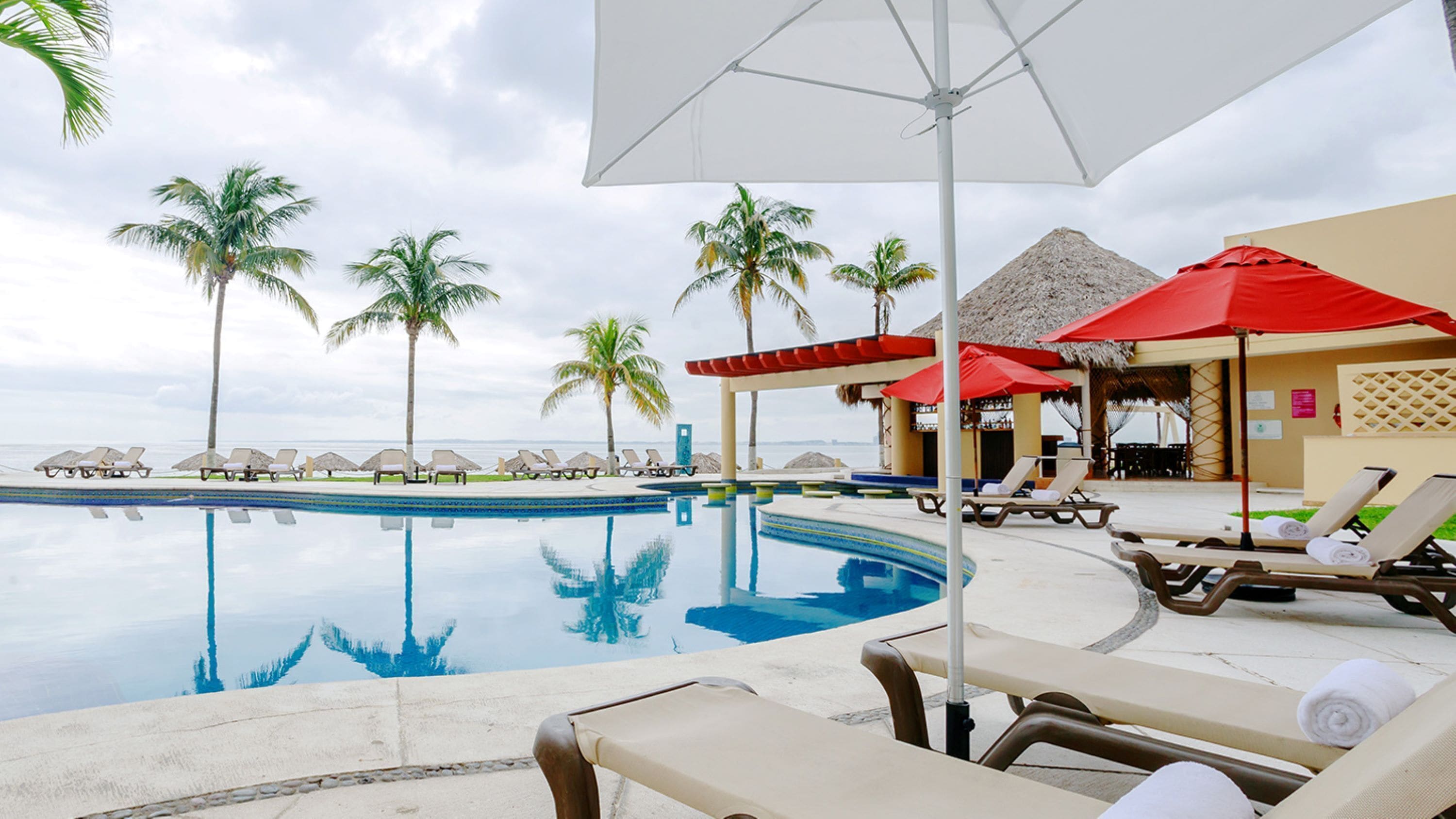 Outdoor pool, open 8:00 AM to 8:00 PM, pool umbrellas, pool loungers